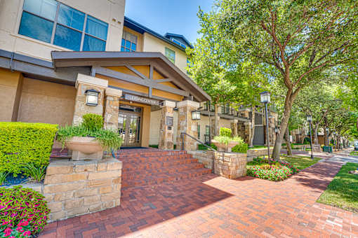 A building with a brick walkway in front of it.