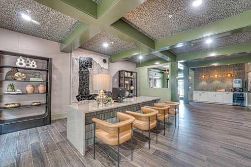 A modern kitchen with a bar area and seating.