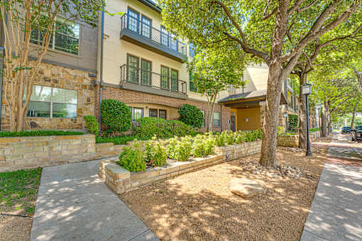 A tree in front of a house.