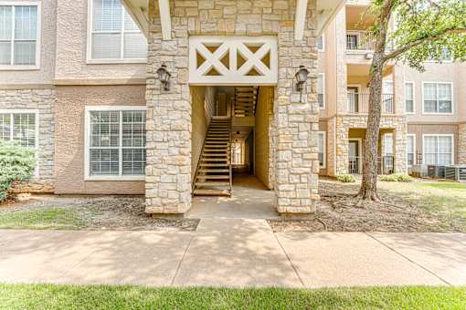A stone building with a wooden entrance. at The Brazos, Dallas