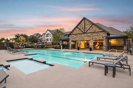 large house with a pool at Vine + Vail Townhomes and Apartments, Grapevine, 76051