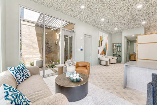 Modern lobby with textured ceiling and reception desk at The Barton Apartments, Texas, 75206