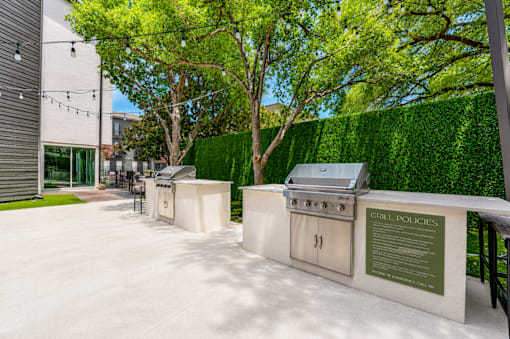 Outdoor grilling stations with built in amenities at The Barton Apartments, Dallas, 75206