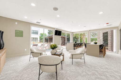 Community lounge with floor to ceiling windows at The Barton Apartments, Dallas, TX 75206
