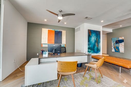 Modern home office with dual monitor workspace at Vue Live Oak Apartments, Dallas, 75204