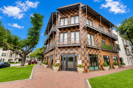 Leasing center entrance with checkerboard facade at The Montrose Apartments, Dallas, Texas