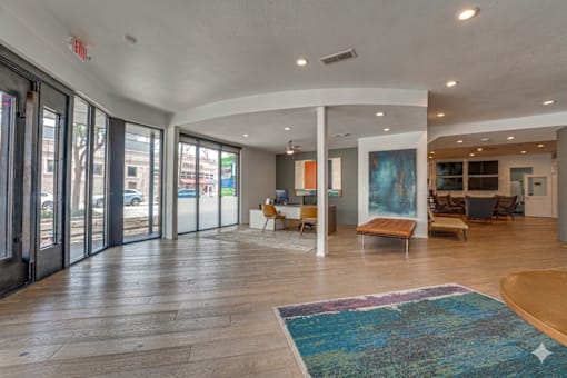 Spacious lobby with modern seating and artwork at Vue Live Oak Apartments, Dallas, TX 75204