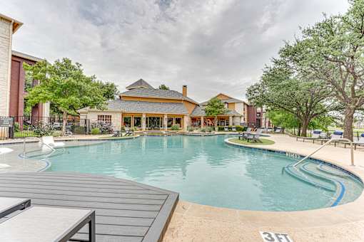 A large outdoor swimming pool with a 3 feet depth marker at Limestone Ranch Apartments, Lewisville, TX