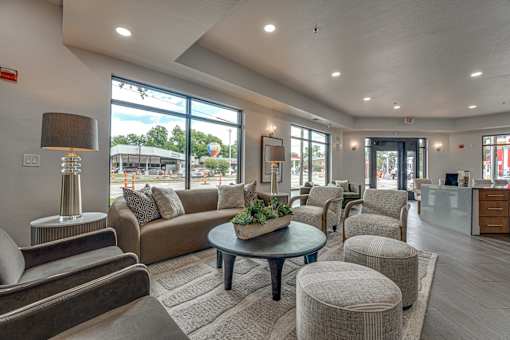Clubhouse lobby with contemporary furnishings and reception desk at The Montrose Apartments, Dallas