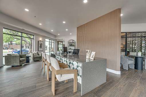 Contemporary workspace with vertical wood slat accent wall at The Montrose Apartments, Dallas, TX 75204
