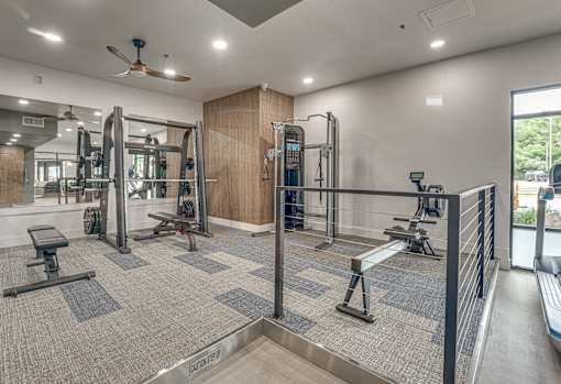 Fitness center with strength training equipment at The Montrose Apartments, Dallas, TX 75204