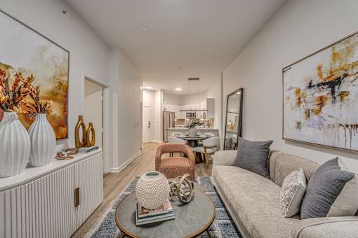 Open concept living room with neutral decor at The Montrose Apartments, Texas, 75204