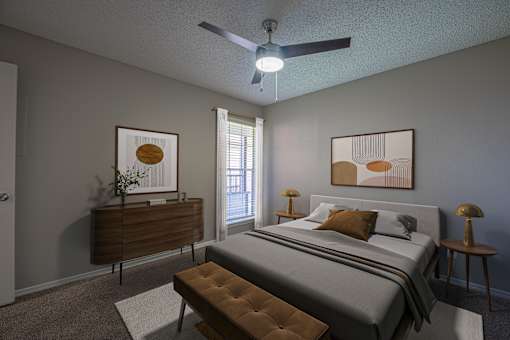 A bedroom with a bed, nightstand, and a ceiling fan.