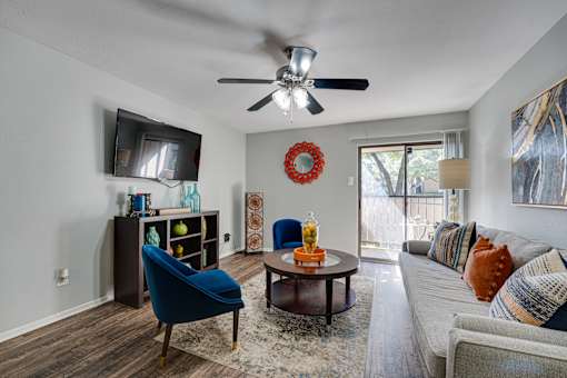 Couch in front of TV in a living room at Southern Oaks, Fort Worth, 76132  