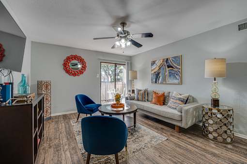 living room with lamp and fan at Southern Oaks, Fort Worth, TX 76132  
