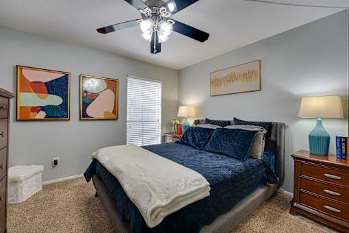 bedroom with two wall art pieces at Southern Oaks, Fort Worth  