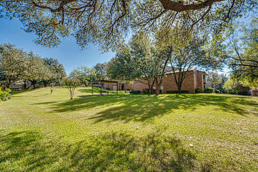 house is surrounded by trees at Southern Oaks, Fort Worth Texas