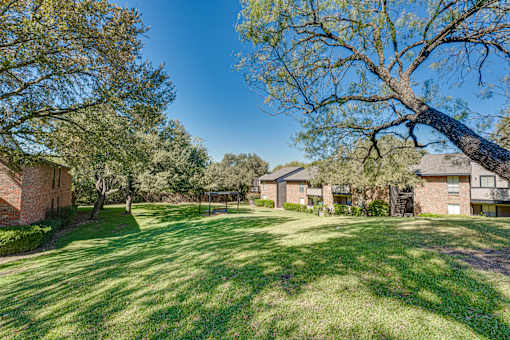 large grassy area with trees at Southern Oaks, Fort Worth, TX