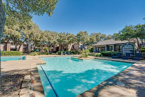 large swimming pool with trees at Southern Oaks, Fort Worth