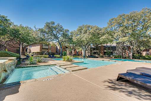 pool with stone wall at Southern Oaks, Fort Worth, TX 76132