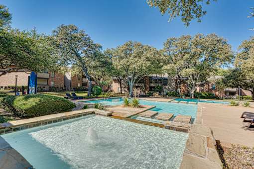 pool with a fountain at Southern Oaks, Fort Worth Texas