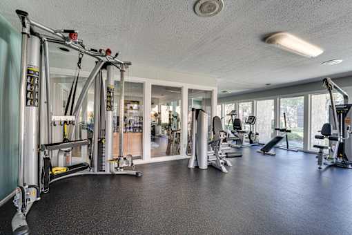 gym with a variety of equipment at Southern Oaks, Fort Worth, 76132  