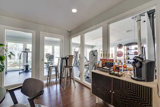 room with a bar and chairs at Southern Oaks, Fort Worth, 76132  