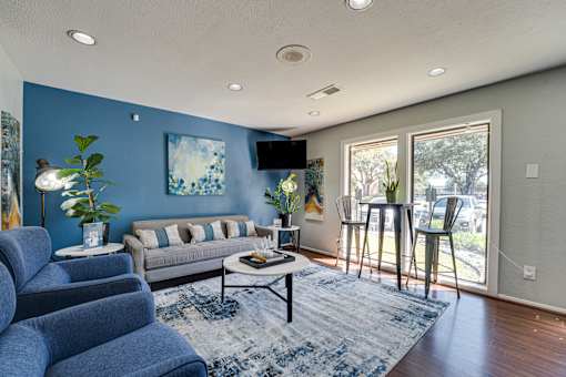 grey sofa and blue couch in a room at Southern Oaks, Texas, 76132