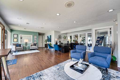 living room with blue chairs at Southern Oaks, Texas