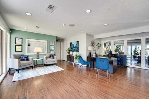 blue chair and a white couch in living room at Southern Oaks, Fort Worth, 76132  