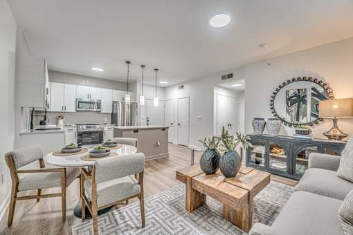 Open living area with dining table and modern furnishings at The Barton Apartments, Dallas, 75206