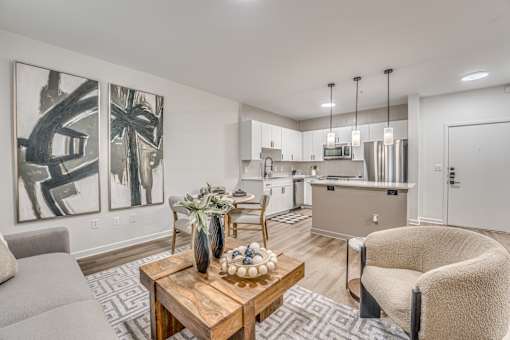 Open concept living area with modern kitchen at The Barton Apartments, Dallas, Texas