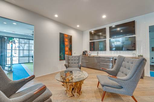 Contemporary living room with wet bar at Vue Live Oak Apartments, Dallas, Texas