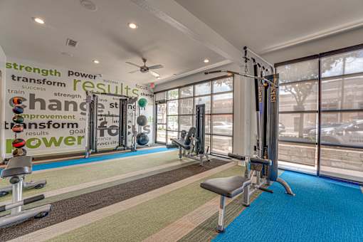 Fitness center with cable machines and equipment at Vue Live Oak Apartments, Dallas, TX 75204