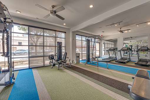 Fitness center with cardio and strength equipment at Vue Live Oak Apartments, Dallas, 75204