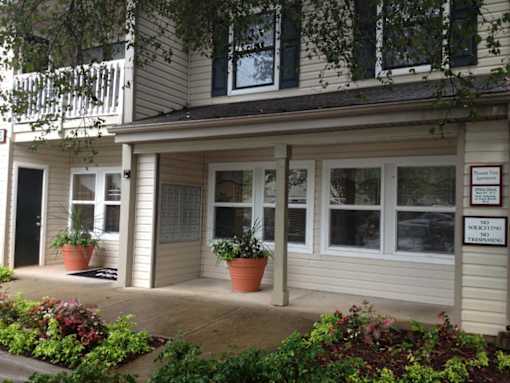 A building with a sign that says "No Soliciting Treatment".