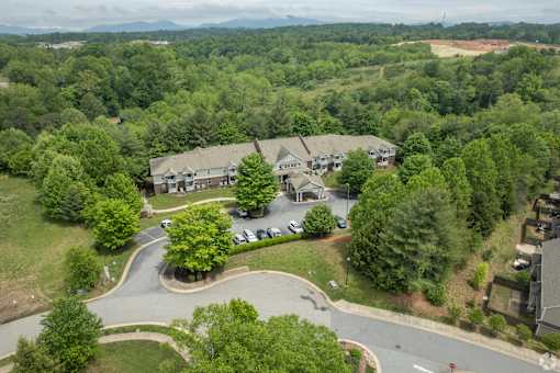 A bird's eye view of a residential area with houses and trees.