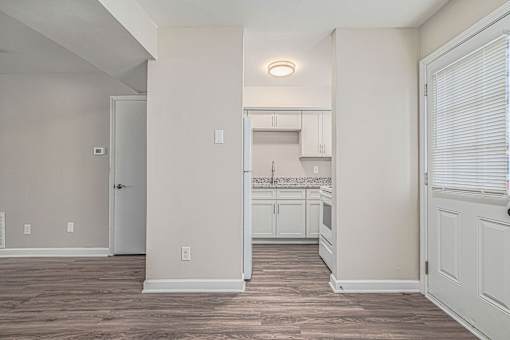 A kitchen area with a countertop and cabinets.