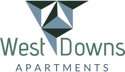 A logo with a geometric design and the text "West Downs Apartments".
