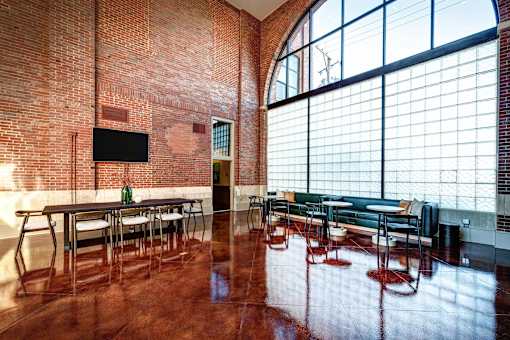 Ovaltine Court clubroom with a wall of floor-to-ceiling windows