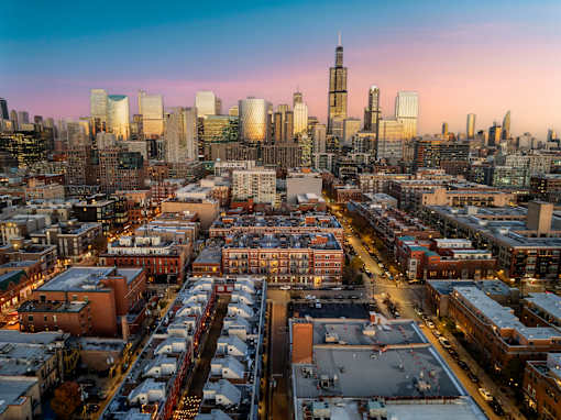 A cityscape with a mix of residential and commercial buildings.