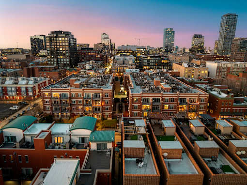 A cityscape with a mix of residential and commercial buildings.