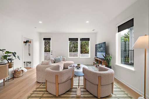 A living room with a large couch and a small table.