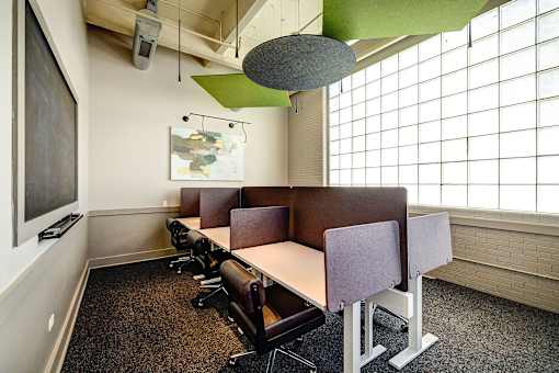 Professional conference space with sleek workstations and white accents