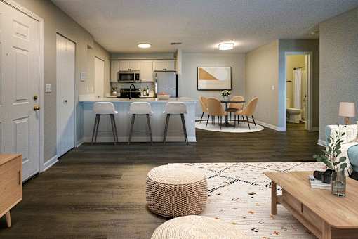 A modern kitchen with a dining table and chairs.