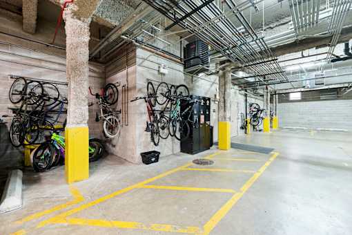 A bike rack with bicycles in a garage.