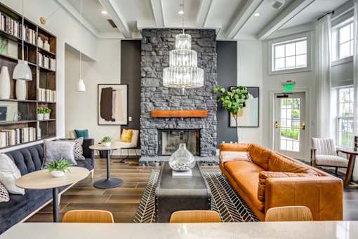 a living room with couches and a fireplace