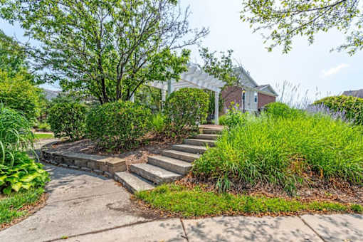 a set of concrete steps leading up to a house