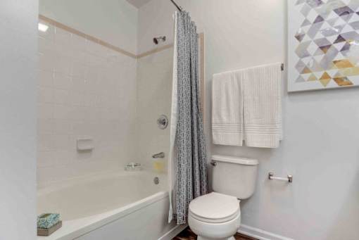 a bathroom with a toilet and a tub
