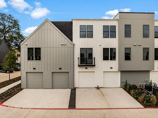 A modern two-story house with a garage.